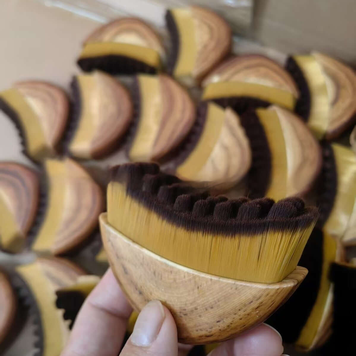 Facial lymphatic drainage brush for detoxifying and glowing skin, showcasing its unique shape and bristles.